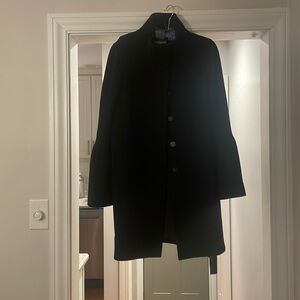 Black wool mid length coat with back button detail. Size Large- loft